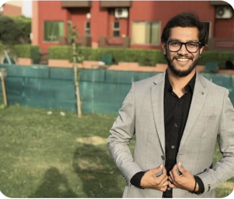 Bhavik Sarkhedi in a grey suit outdoors